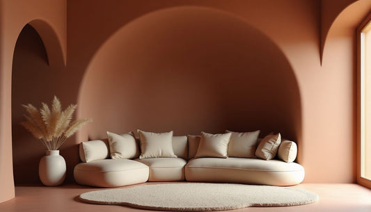 Warm terracotta living room with organic, sculpted "hugging" walls & plush, soft furniture.