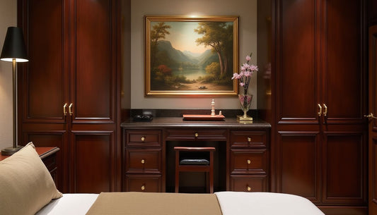 Luxurious bedroom dressing area, dark wood cabinetry, brass hardware, leather valet stand, classical landscape wall art. Interior design.